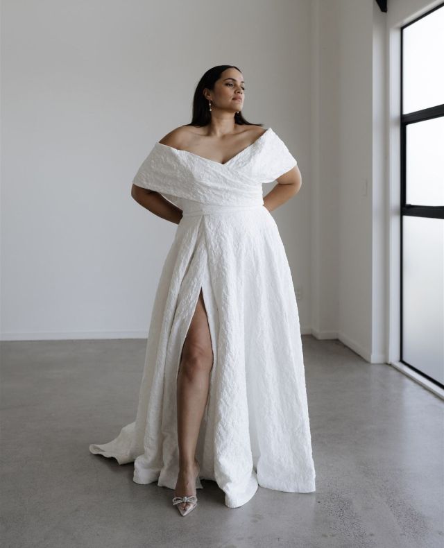 Introducing the CASSI V2 gown by @heracouture.⁠
⁠
Featuring perfectly draped off the shoulder sleeves that accentuate the décolletage and fold effortlessly to create a retro bodice design.⁠
Cassi is made from a jacquard fabric, infused with lycra making this one of the most comfortable gowns to wear, and perfect for celebrations.⁠
⁠
Now on its way to our Christchurch and Wellington boutiques. ⁠
⁠
Book an appointment via www.paperswanbride.co.nz to try her in our Wellington or Christchurch boutiques.⁠
⁠