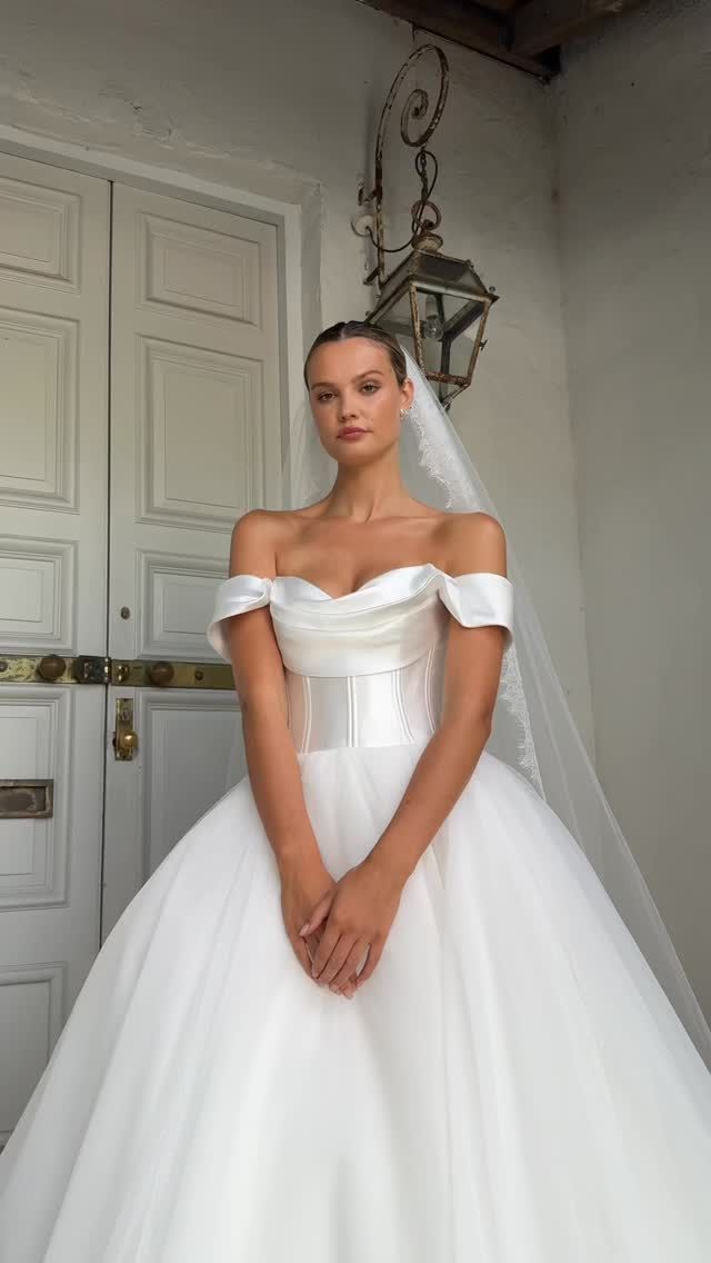 Off-the-shoulder, on every wishlist.
FREDA brings couture structure and main character energy down the aisle. 

—-
Hera Couture, Bridal Inspiration, New Zealand Weddings, Modern Bride, Timeless wedding gown, Wellington Weddings, Christchurch Weddings